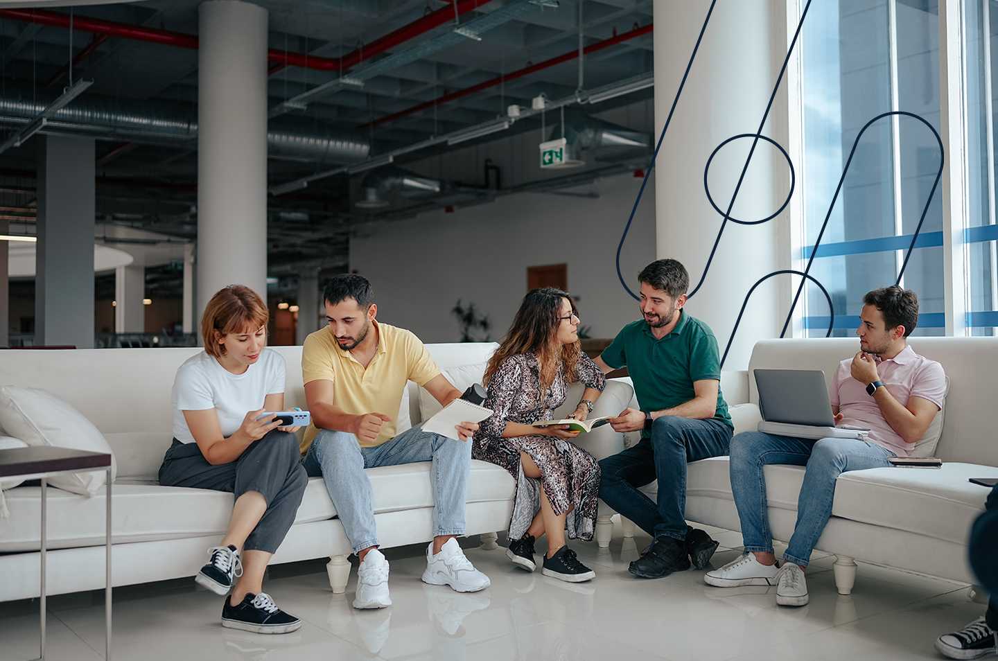 coworkers sitting around an L-shaped couch