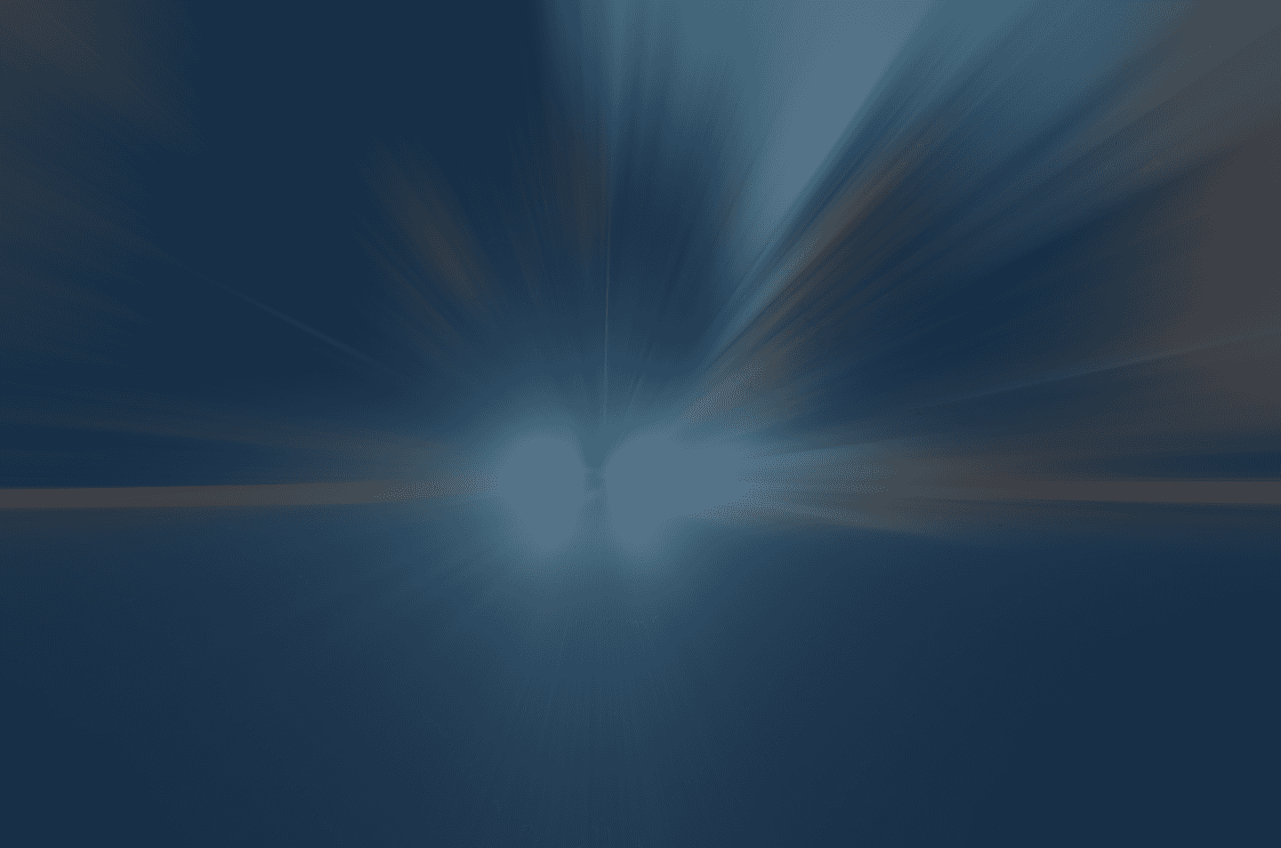 an abstract image showing car headlights in the distance