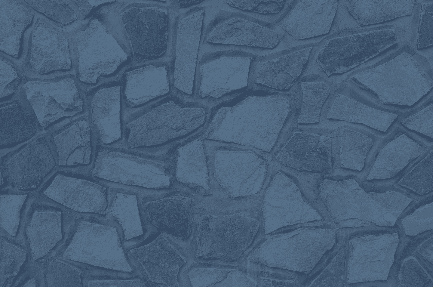 a stone wall with a blue overlay