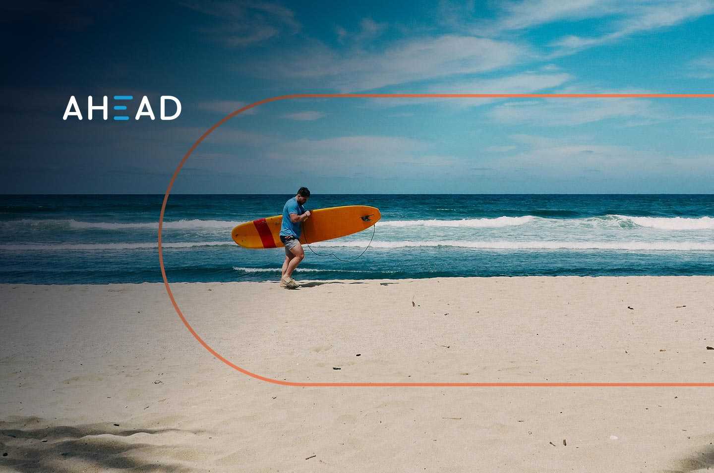 a man walking on a beach carrying a surfboard
